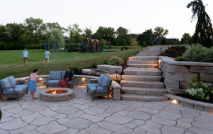 stone steps with firepit, kids playing with parents